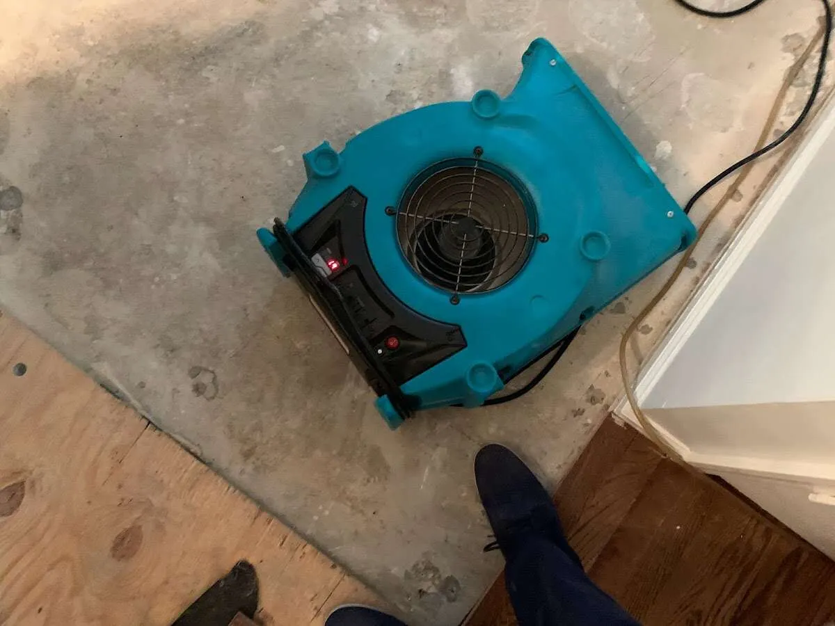 Air mover drying subfloor during Leak Detection & Repair in Caribou